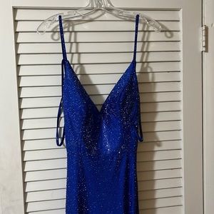 Size 10 Ellie Wilde royal blue dress with an open back and a long train.